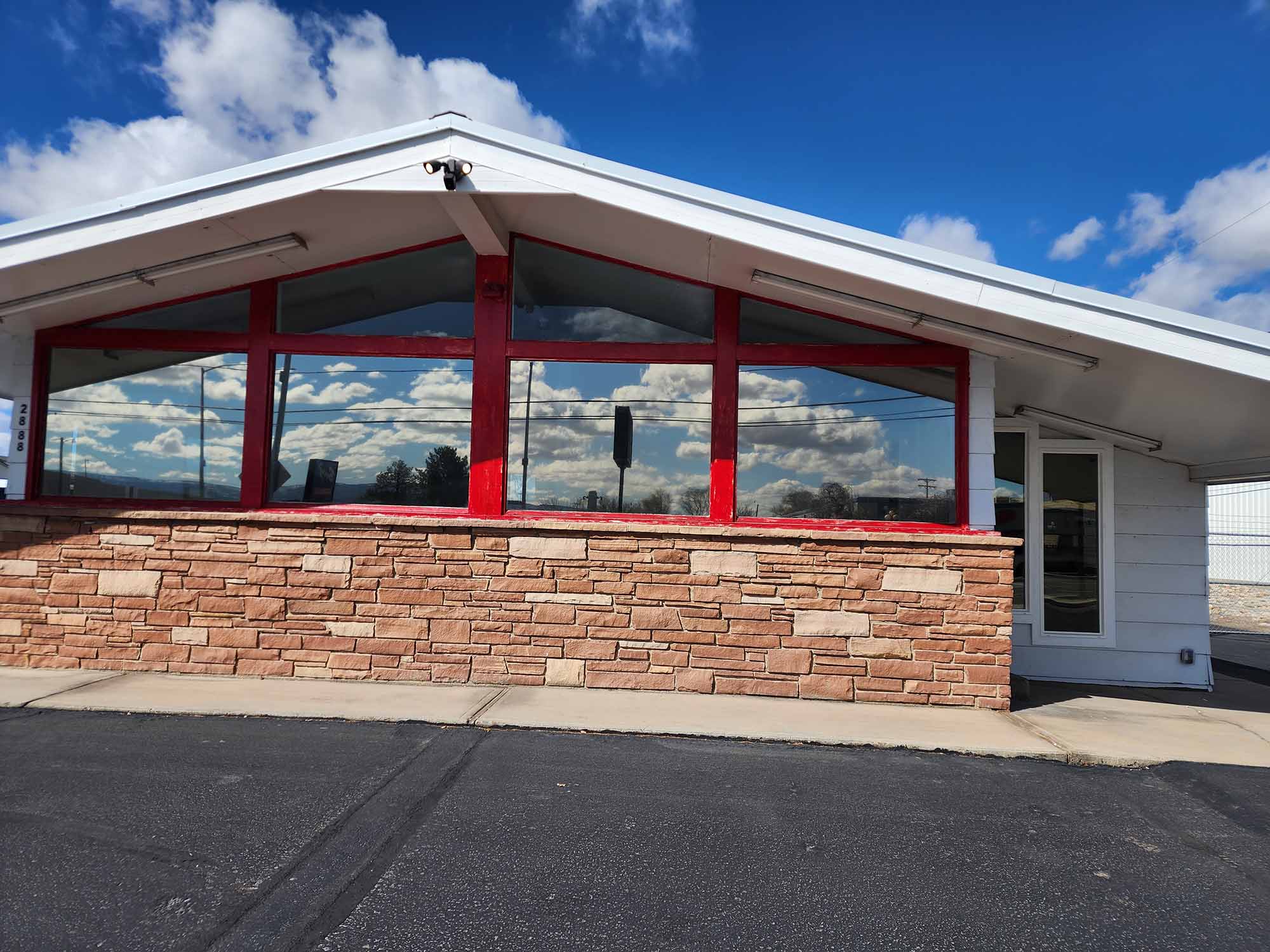 Exterior building view featuring high-performance reflective commercial window tint